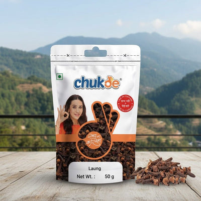 Packaged Laung with chukde branding on a wooden surface with a mountainous background