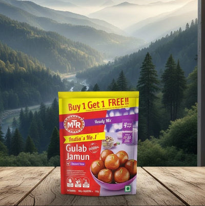 MTR Gulab Jamun packet with a scenic mountain view in the background