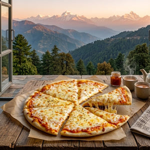 Cheese pizza with a slice missing on a wooden table with a scenic mountain view.