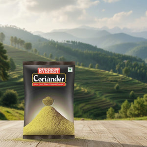 Everest Coriander packaging with a scenic background of mountains and trees.