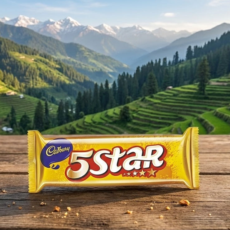 5 Star candy bar on a wooden surface with a mountainous landscape in the background