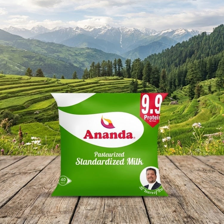 Ananda milk package on a wooden table with a scenic mountain background