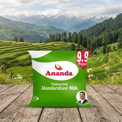 Ananda milk package on a wooden table with a scenic mountain background