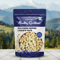 Package of Nutty Gritties Southern Pepper Cashew Nuts with a mountainous landscape in the background