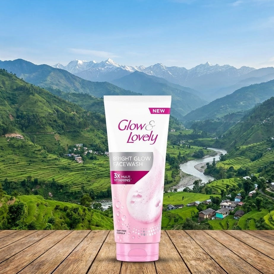 Glow & Lovely product on a wooden surface with a scenic mountain background