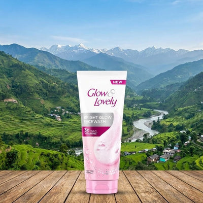 Glow & Lovely product on a wooden surface with a scenic mountain background