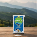 I-Shakti product packaging on a wooden surface with a mountainous landscape in the background
