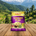Jalani Golgappa Magic packet on a wooden surface with a mountainous landscape in the background