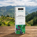 Kapiva Karela Jamun Juice box with a scenic mountain background