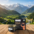 Kapiva Shilajit packaging with a scenic mountain backdrop