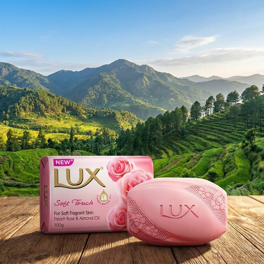 Lux soap bar and packaging on a wooden surface with a scenic mountain background