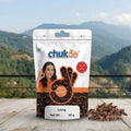 Packaged Laung with chukde branding on a wooden surface with a mountainous background