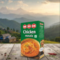 MDH Chicken masala box with a scenic mountain background