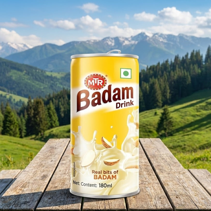 MTR Badam Drink can on a wooden table with a mountainous landscape in the background