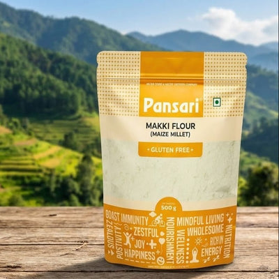 Pansari Makki Flour package on a wooden surface with a mountainous landscape in the background