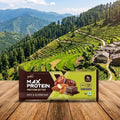 Max Protein package on a wooden surface with a scenic mountain landscape in the background