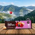 Max Protein Daily fruit and nut bar packaging with a mountainous landscape in the background