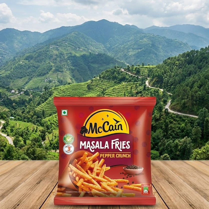 Packaging of McCain Masala Fries with a scenic mountain background