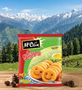 Packaging of McCain Smiles potato products with a mountainous landscape in the background