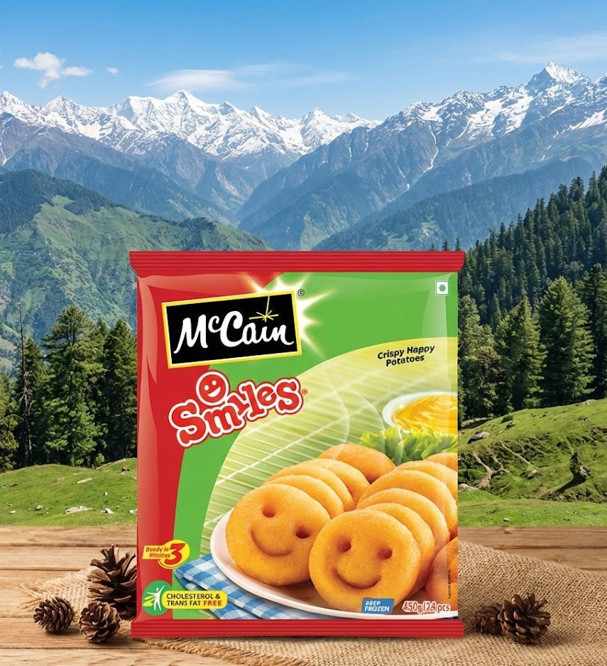 Packaging of McCain Smiles potato products with a mountainous landscape in the background
