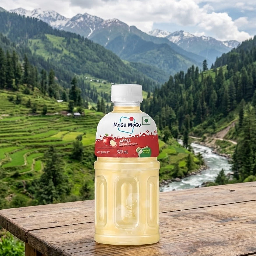 Mogu Mogu bottle on a wooden table with a scenic mountain landscape in the background