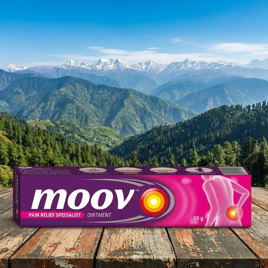 moov ointment box on a wooden surface with a mountainous landscape in the background