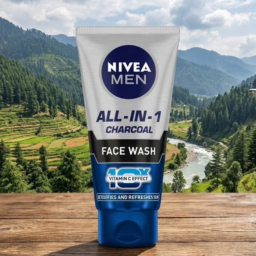 Nivea Men All-in-1 Charcoal Face Wash tube with a scenic background of mountains and trees.