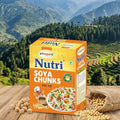 Nutri Nutya Soya Chunks packaging with a scenic mountain background