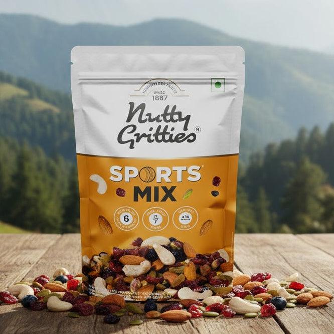 Bag of Nutty Gritties Sports Mix on a wooden surface with a mountainous landscape in the background