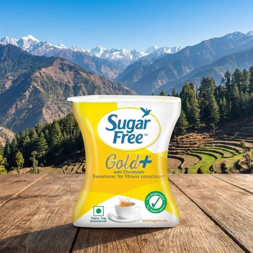 Sugar Free Gold+ packaging on a wooden surface with a mountainous landscape in the background