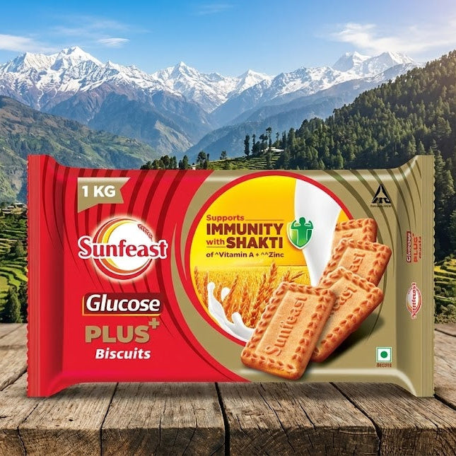 Sunfeast Glucose Plus Biscuits package with a mountainous landscape in the background
