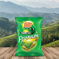 Tata Tea Premium packet with a scenic background of tea fields and mountains