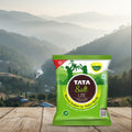 Tata Salt Lite packet on a wooden surface with a mountainous landscape in the background