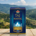 Taj Mahal tea box on a wooden surface with a scenic background