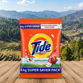 Tide detergent packet with a scenic background of mountains and trees