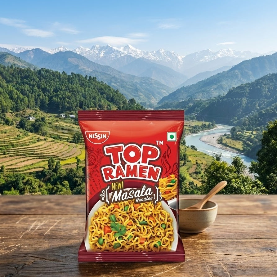 Nissin Top Ramen Masala package with a scenic mountain background