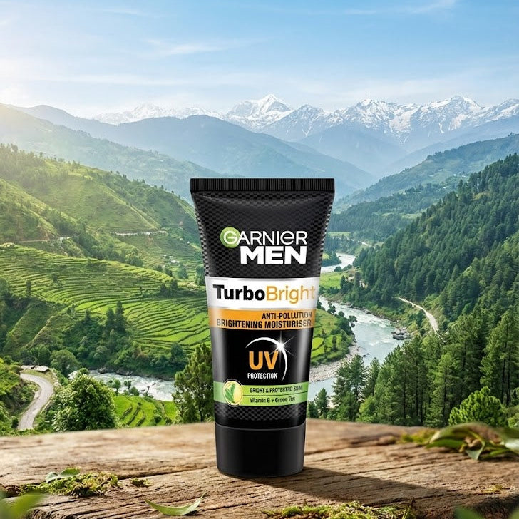 Garnier Men Turbo Bright product on a wooden surface with a scenic mountain landscape in the background