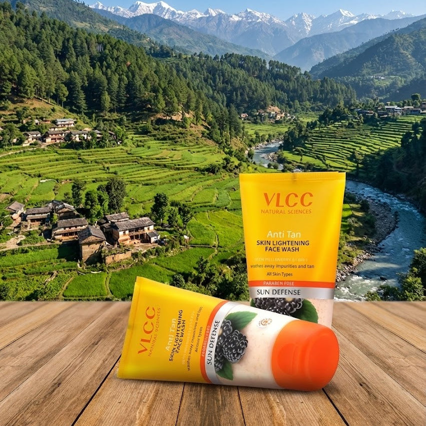 VLCC skincare products on a wooden surface with a scenic mountain landscape in the background