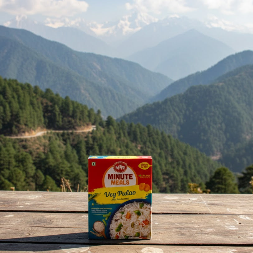 Box of Minute Maid Veg Pulao on a wooden table with a mountainous landscape in the background