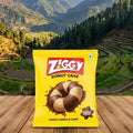 Ziggy Donut Cake package on a wooden surface with a mountainous landscape in the background
