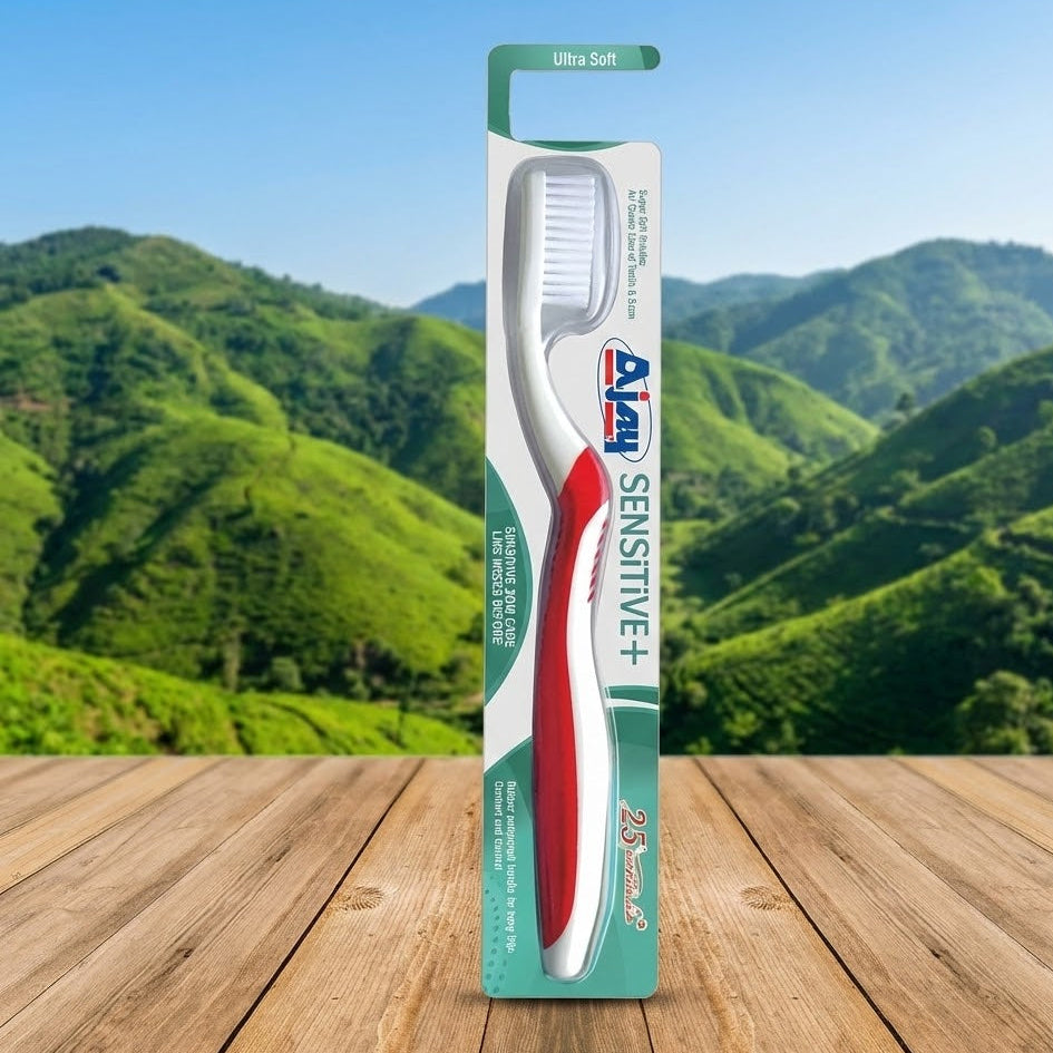 Ampy Sensitive+ toothbrush packaging with a mountainous landscape in the background