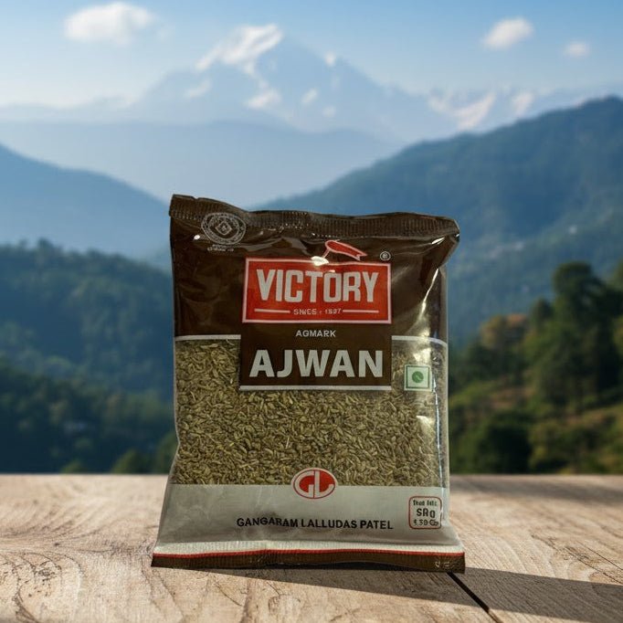 Package of Victory Ajwan seeds on a wooden surface with a mountainous landscape in the background