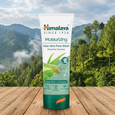 Himalaya Aloe Vera Face Wash tube with a mountainous landscape in the background