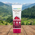 Mamaearth Beetroot Gentle Face Wash tube with a mountainous landscape in the background