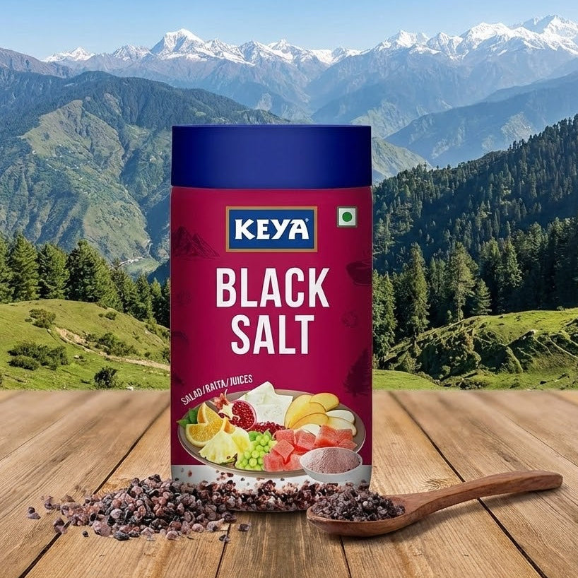 Keya Black Salt packaging with a scenic mountain background