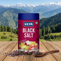 Keya Black Salt packaging with a scenic mountain background