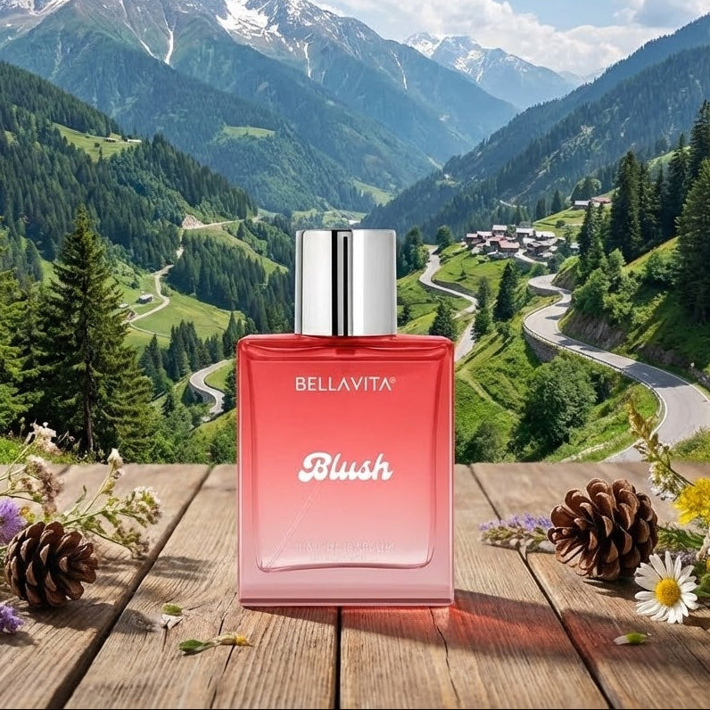 BellaVita Blush perfume bottle with a mountainous landscape in the background