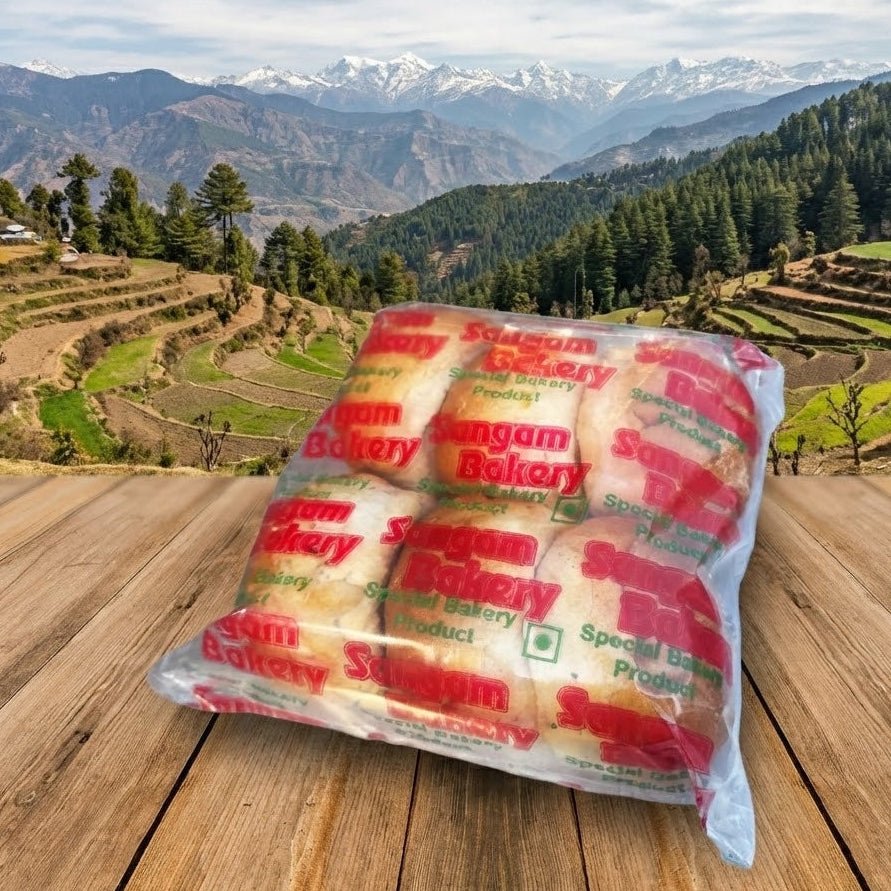 Packaged bread on a wooden surface with a scenic mountain background