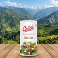 Can of Catch Table Salt with a scenic mountain background