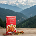 Box of Everest Chicken Masala with a mountainous landscape in the background